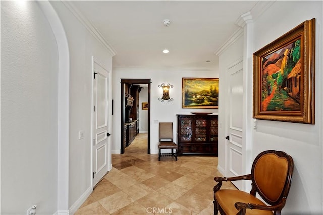 hallway featuring crown molding