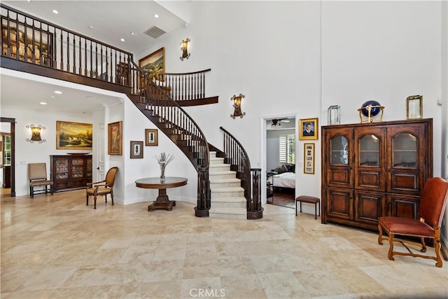 foyer entrance with a towering ceiling