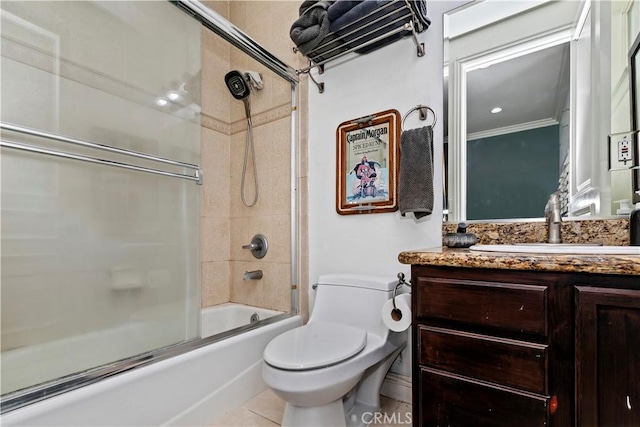 full bathroom featuring shower / bath combination with glass door, vanity, ornamental molding, toilet, and tile patterned floors