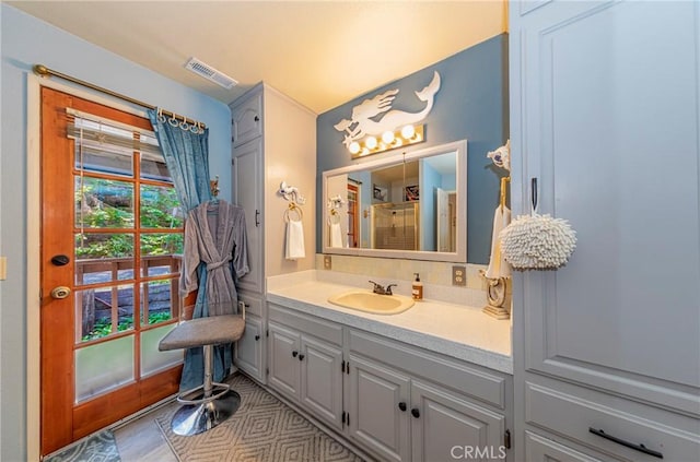 bathroom featuring vanity and walk in shower