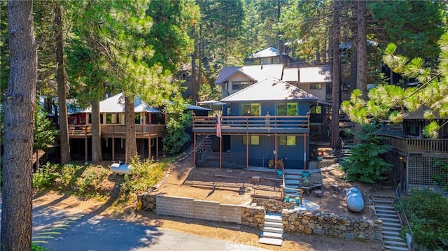 rear view of property with a deck