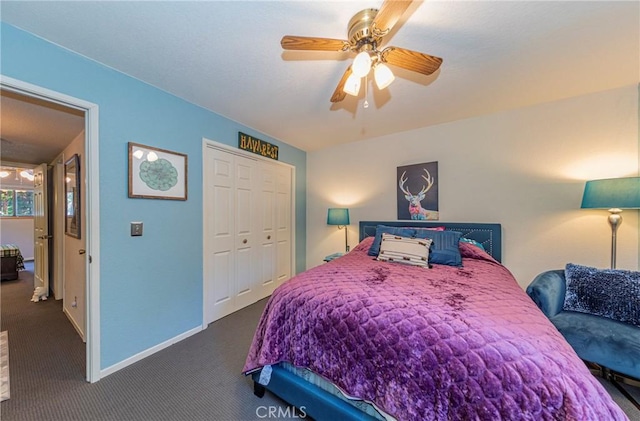 bedroom featuring ceiling fan, a closet, and dark carpet