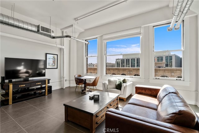 living room featuring dark tile patterned flooring