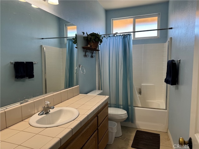 full bathroom featuring shower / bath combo with shower curtain, tile patterned flooring, vanity, and toilet