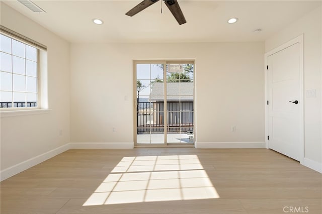 empty room featuring recessed lighting, visible vents, baseboards, and light wood finished floors