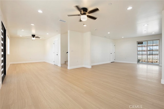 spare room with light wood-type flooring, visible vents, recessed lighting, baseboards, and ceiling fan