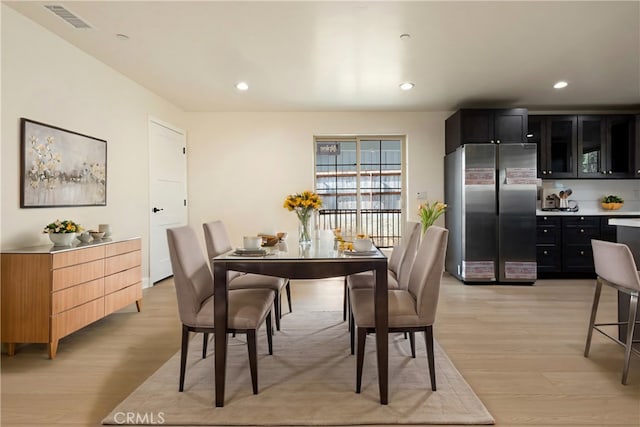 dining room featuring recessed lighting, visible vents, and light wood-style floors