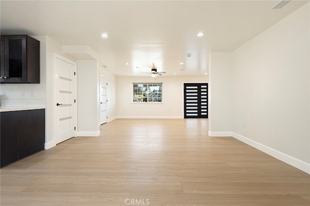 unfurnished living room featuring baseboards, visible vents, recessed lighting, ceiling fan, and light wood-type flooring