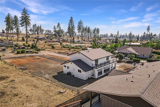 birds eye view of property with a residential view