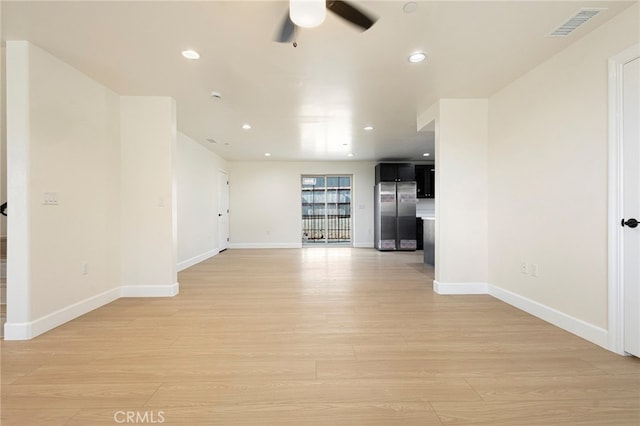 empty room featuring recessed lighting, visible vents, baseboards, and light wood-style floors