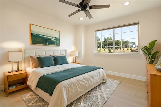 bedroom featuring ceiling fan, recessed lighting, baseboards, and light wood-type flooring