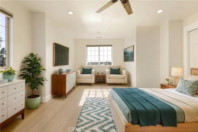 bedroom with light wood finished floors, recessed lighting, baseboards, and ceiling fan