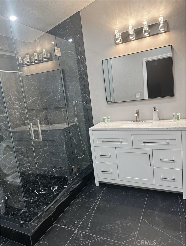 bathroom with vanity and an enclosed shower