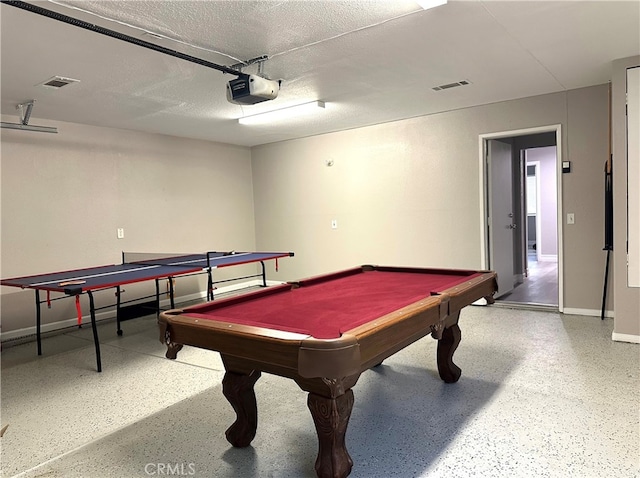 game room featuring a textured ceiling and pool table