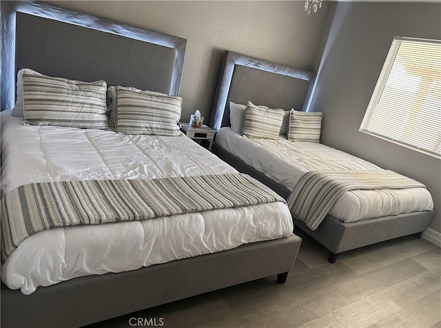 bedroom featuring wood-type flooring