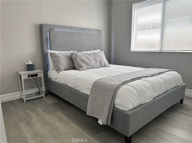 bedroom with wood-type flooring