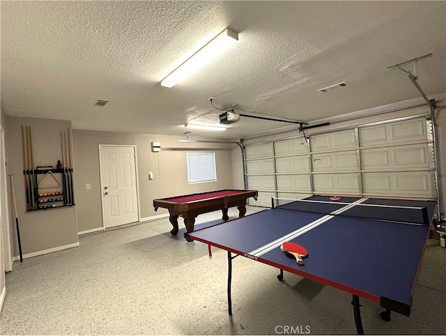 recreation room with a textured ceiling and billiards