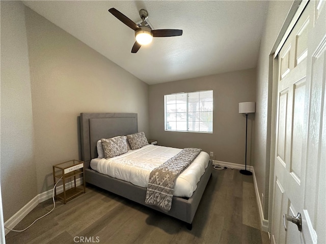 bedroom with ceiling fan and dark wood-type flooring