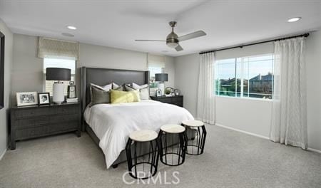 bedroom featuring light carpet and ceiling fan