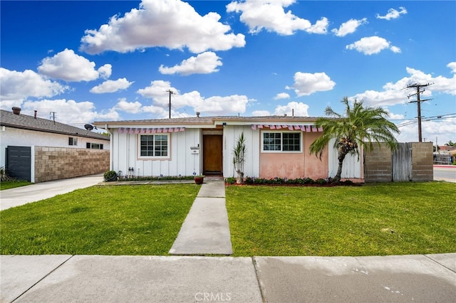 ranch-style house with a front yard