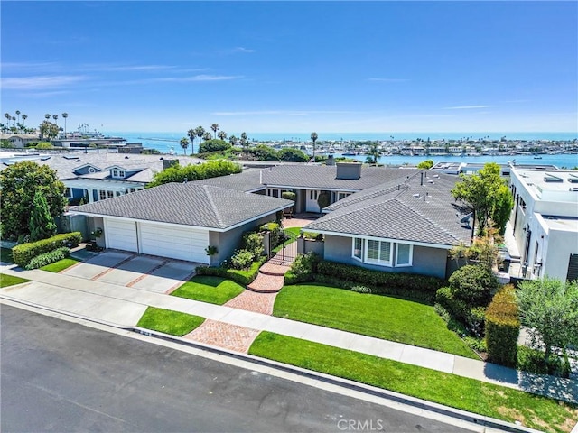 drone / aerial view featuring a water view