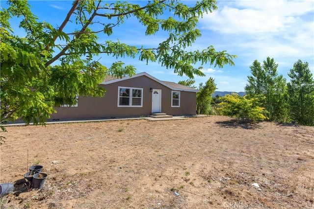 view of front of house featuring stucco siding