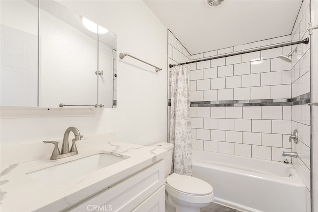 full bathroom with shower / tub combo with curtain, vanity, and toilet