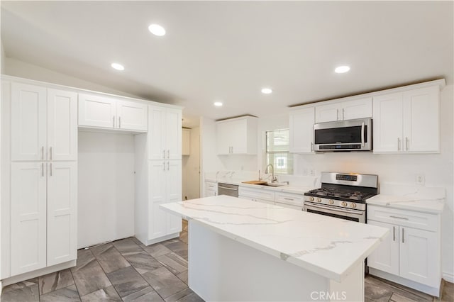 kitchen with white cabinets and appliances with stainless steel finishes