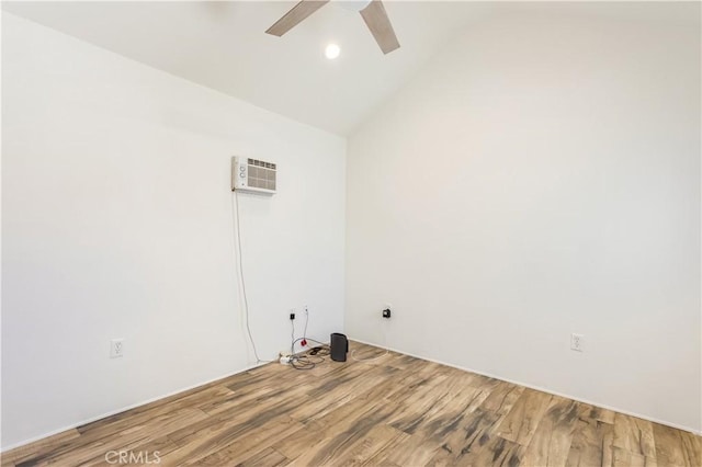 clothes washing area featuring ceiling fan, a wall mounted AC, wood finished floors, and recessed lighting