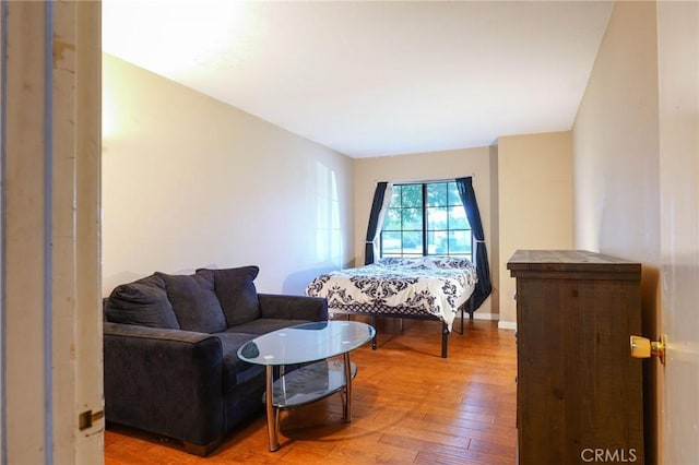 bedroom with hardwood / wood-style flooring