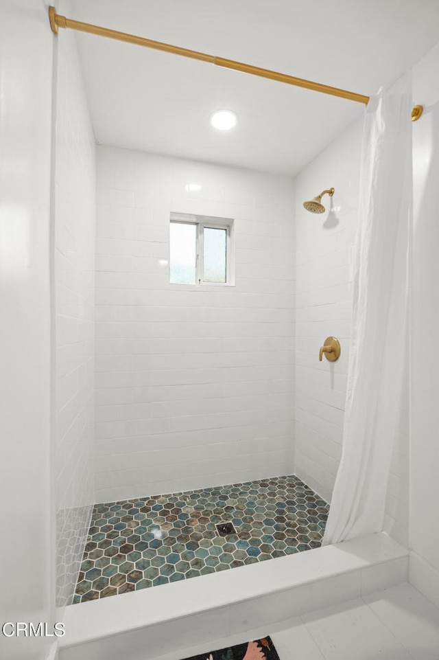 bathroom with a shower with shower curtain