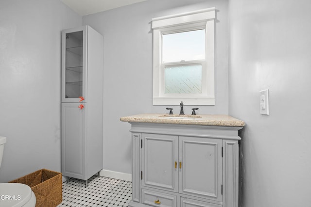 bathroom with vanity and toilet