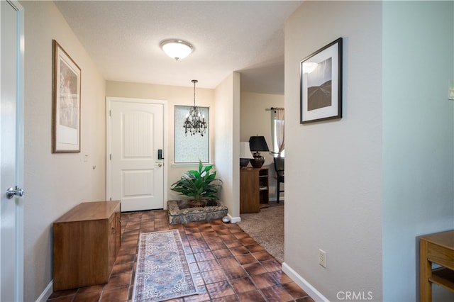 foyer with a chandelier