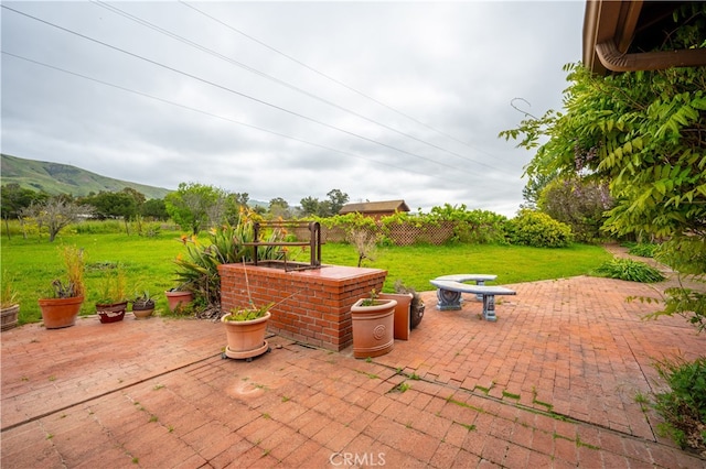 view of patio / terrace featuring a mountain view