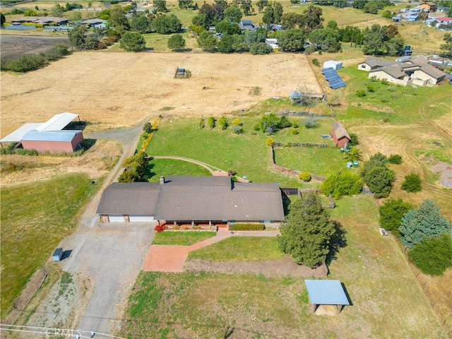 birds eye view of property featuring a rural view