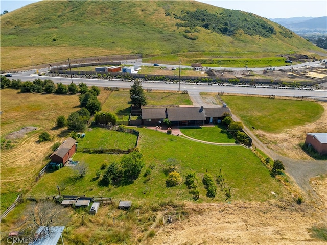 drone / aerial view with a mountain view and a rural view