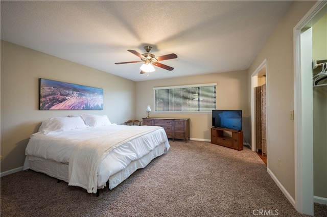 bedroom featuring ceiling fan, carpet floors, and a textured ceiling