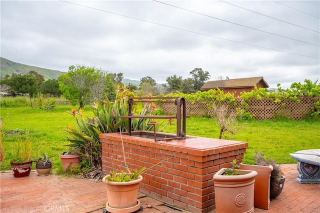 view of patio / terrace with a mountain view