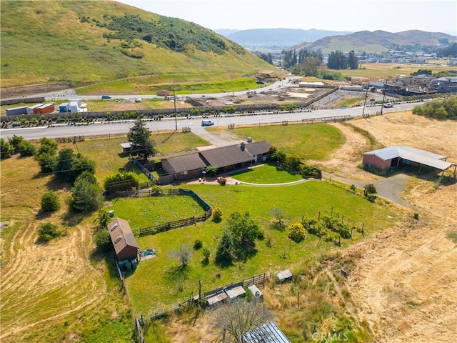 birds eye view of property featuring a mountain view and a rural view