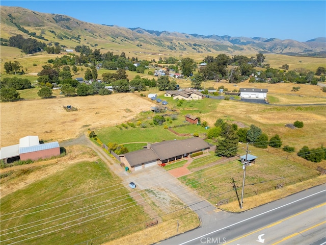 drone / aerial view featuring a rural view and a mountain view