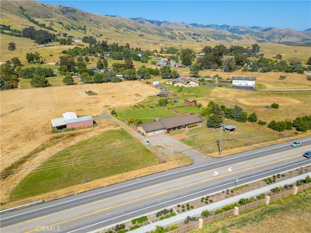 drone / aerial view featuring a rural view and a mountain view