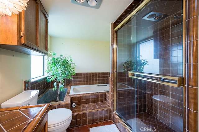 full bathroom with a healthy amount of sunlight, toilet, separate shower and tub, and vanity