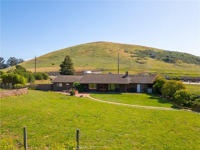 exterior space with a rural view and a mountain view