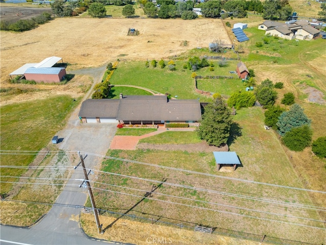 birds eye view of property with a rural view