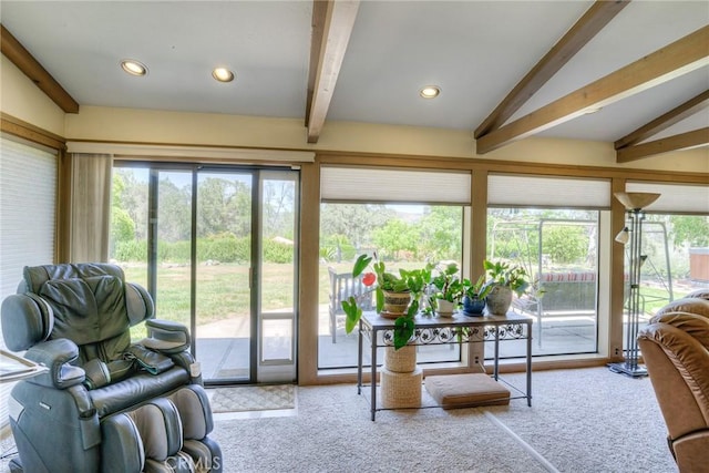 sunroom / solarium with vaulted ceiling with beams