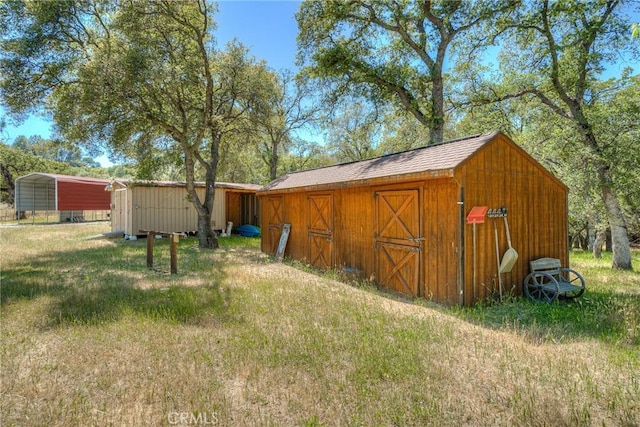 view of outdoor structure with a carport