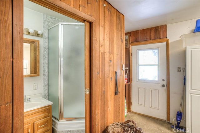 bathroom featuring walk in shower and vanity