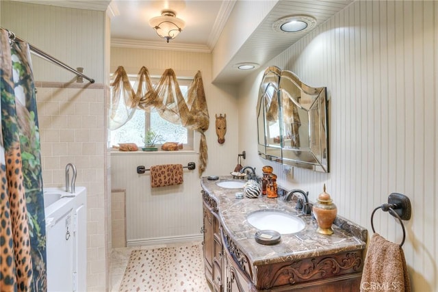 bathroom with crown molding, vanity, and tile patterned floors