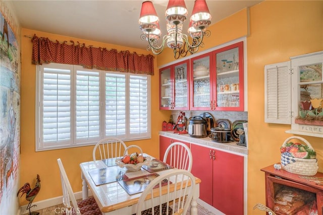 dining room with a notable chandelier