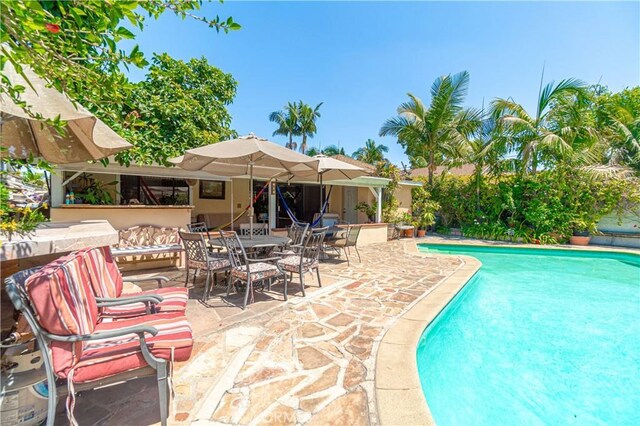 view of swimming pool featuring a patio area